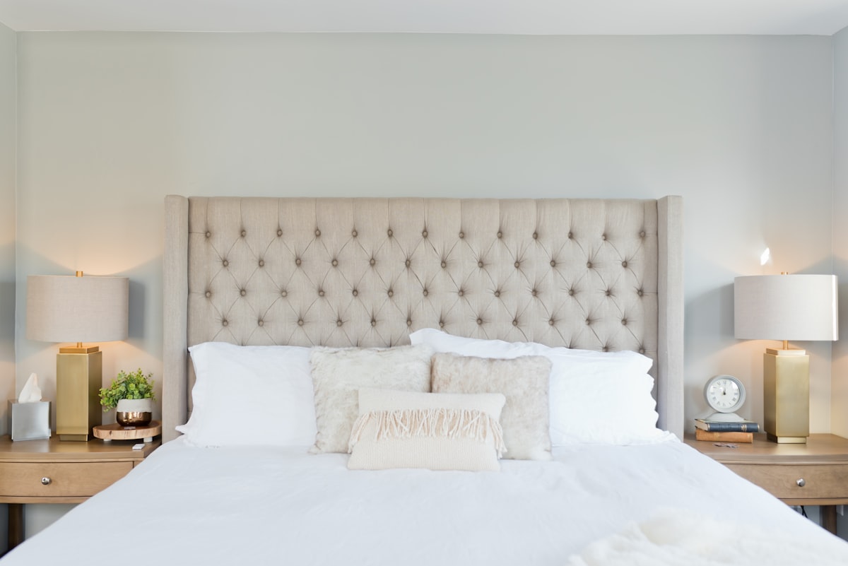 Comfortable Bedding for Guests: a neatly made bed with crisp white linen and pillows